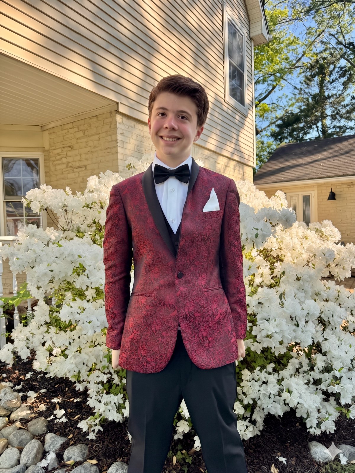 Phil dressed formally and smiling outdoors